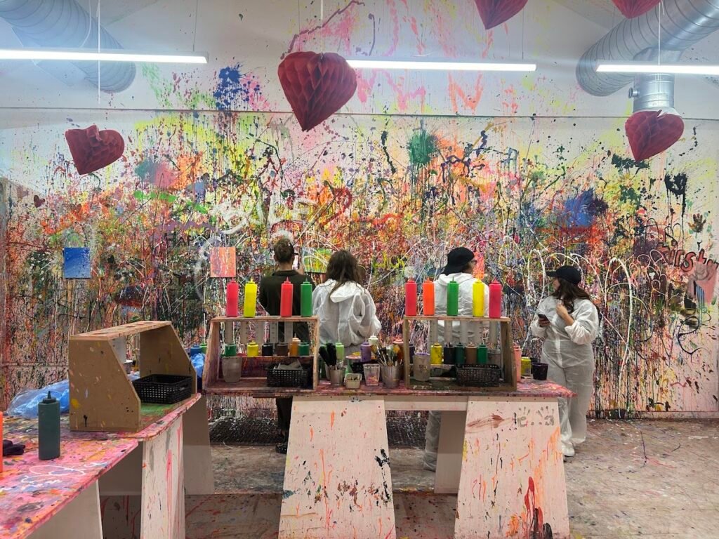 A close-up view of our Paint splatter room, vibrant paint splatters and canvas setups prepared for an interactive art experience Liverpool session.