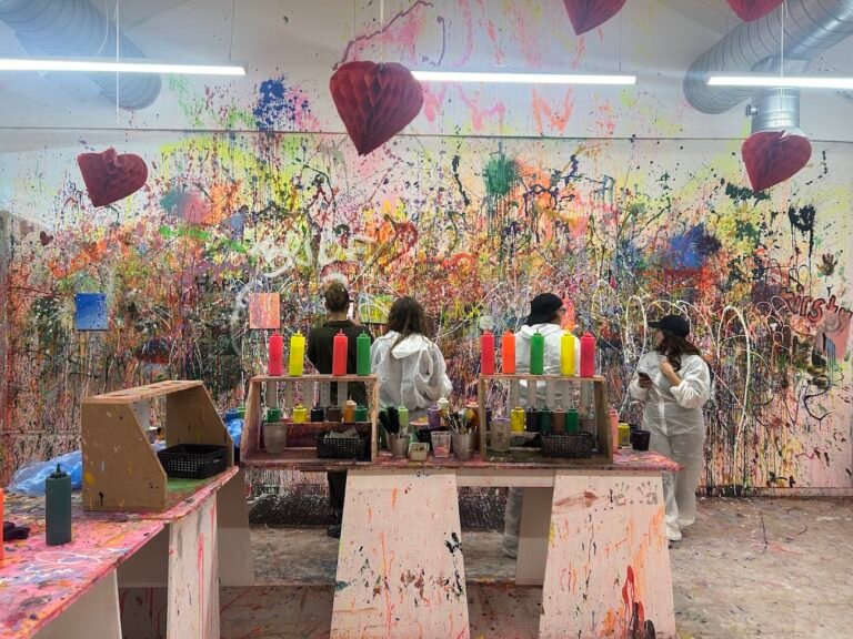 A close-up view of our Paint splatter room, vibrant paint splatters and canvas setups prepared for an interactive art experience Liverpool session.